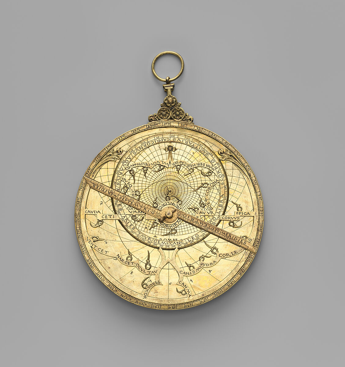 Copper-alloy astrolabe made in 1462 with engraved markings and an openwork star map