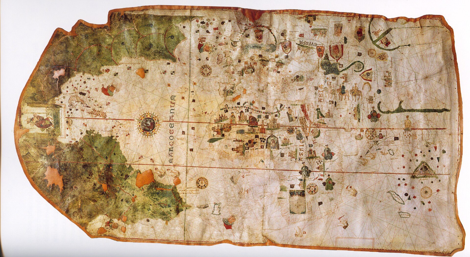Colorful world chart made by Juan de la Cosa around 1500 with coastlines, compass roses, flags, and illustrations